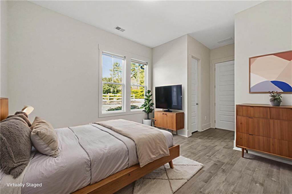 265 Holland Road Powder Springs, GA 30127 - Photo 11 of 27 a bedroom with a bed and a television