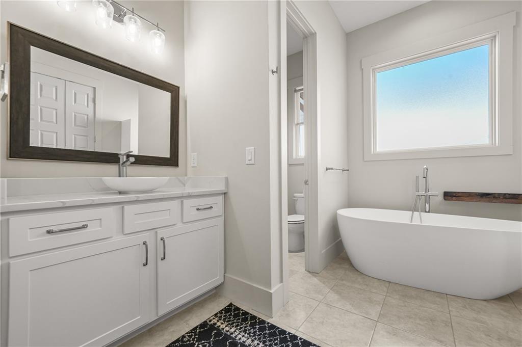 265 Holland Road Powder Springs, GA 30127 - Photo 13 of 27 a bathroom with a bathtub and a sink