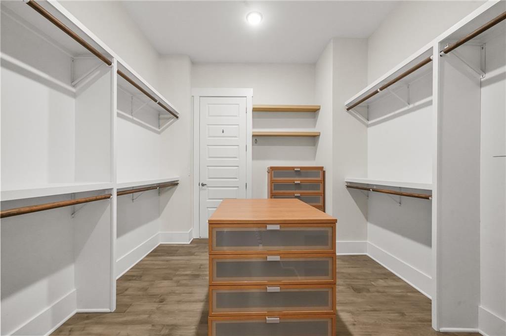 265 Holland Road Powder Springs, GA 30127 - Photo 14 of 27 a view of walk in closet with empty racks