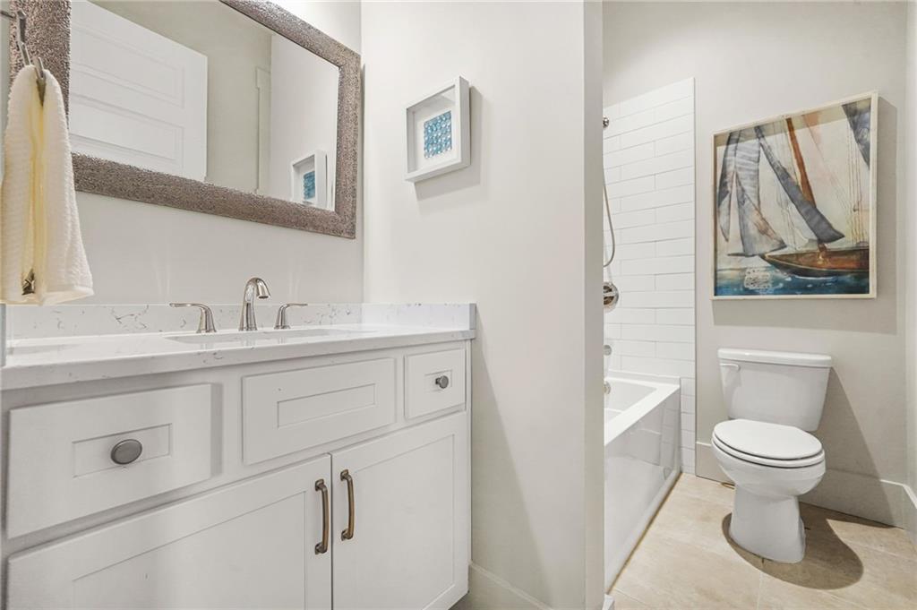 265 Holland Road Powder Springs, GA 30127 - Photo 15 of 27 a bathroom with a toilet sink and mirror