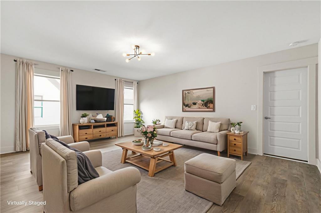 265 Holland Road Powder Springs, GA 30127 - Photo 16 of 27 a living room with furniture and a flat screen tv