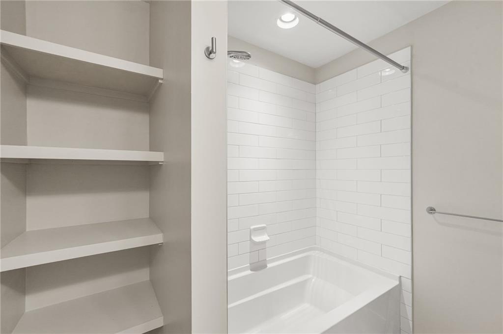 265 Holland Road Powder Springs, GA 30127 - Photo 19 of 27 a bathroom with a bathtub