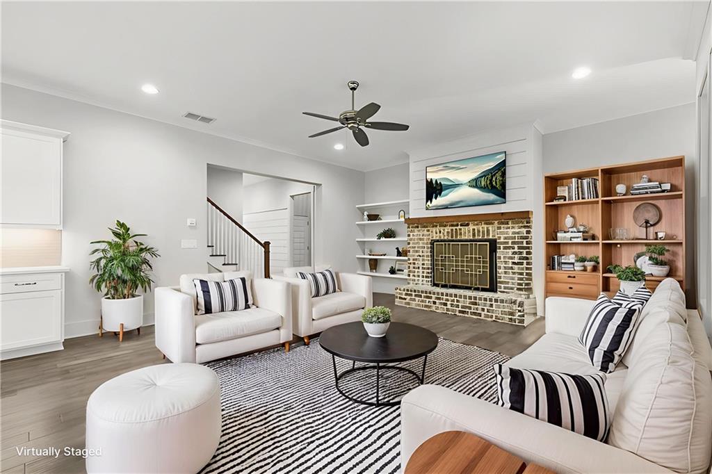 265 Holland Road Powder Springs, GA 30127 - Photo 2 of 27 a living room with furniture fireplace and a potted plant