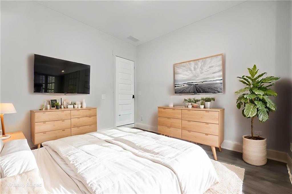 265 Holland Road Powder Springs, GA 30127 - Photo 10 of 27 a bedroom with a bed and a flat screen tv
