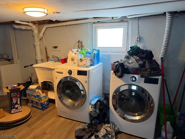 a utility room with sink dryer and washer