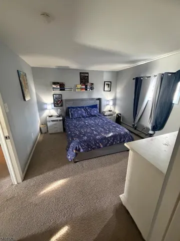a bedroom with a large bed and a couch