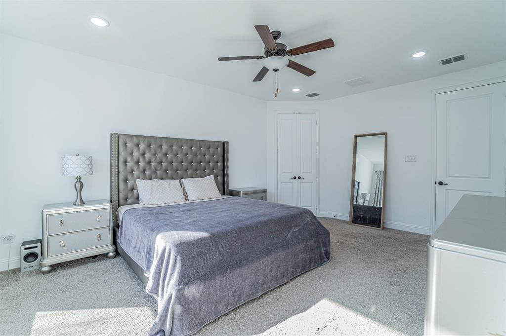 2519 Bedford Road Northlake, TX 76226 - Photo 14 of 33 a bedroom with a bed and a ceiling fan