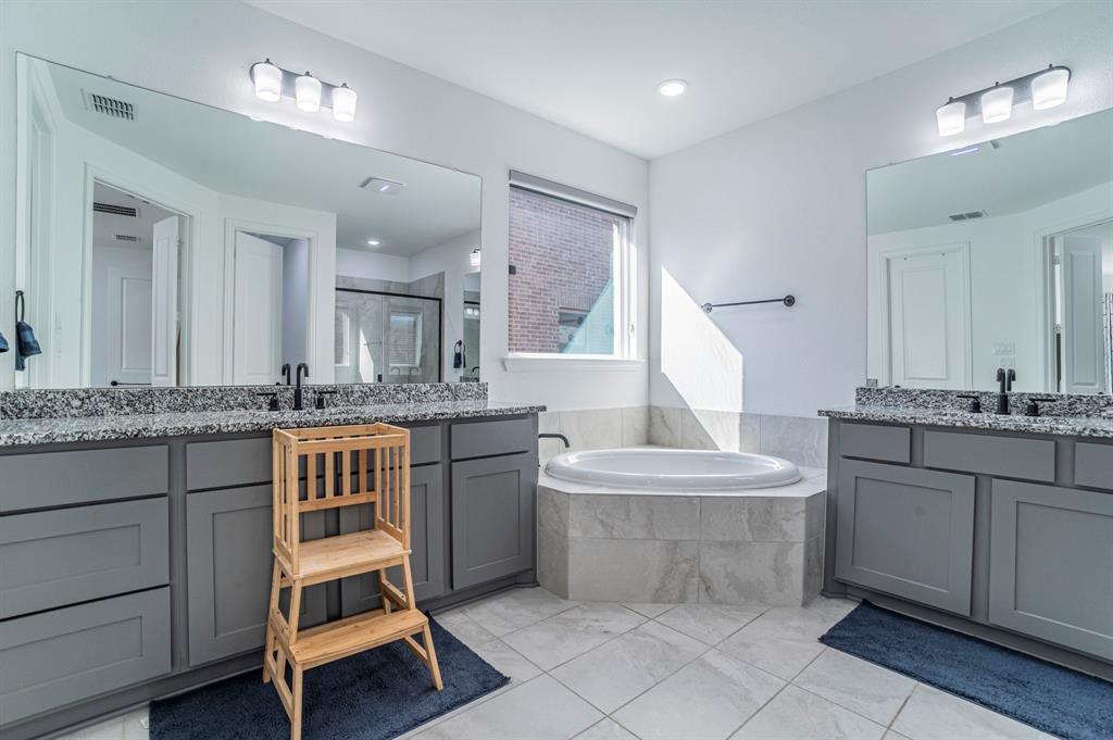 2519 Bedford Road Northlake, TX 76226 - Photo 15 of 33 a bathroom with a granite countertop sink and a mirror