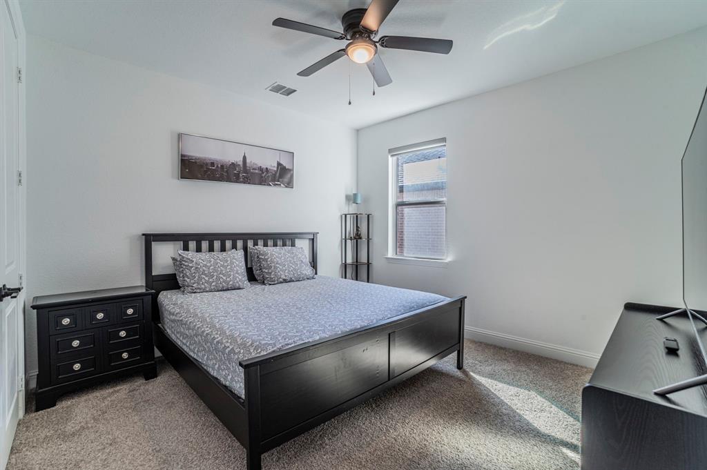 2519 Bedford Road Northlake, TX 76226 - Photo 18 of 33 a bedroom with a bed and a dresser