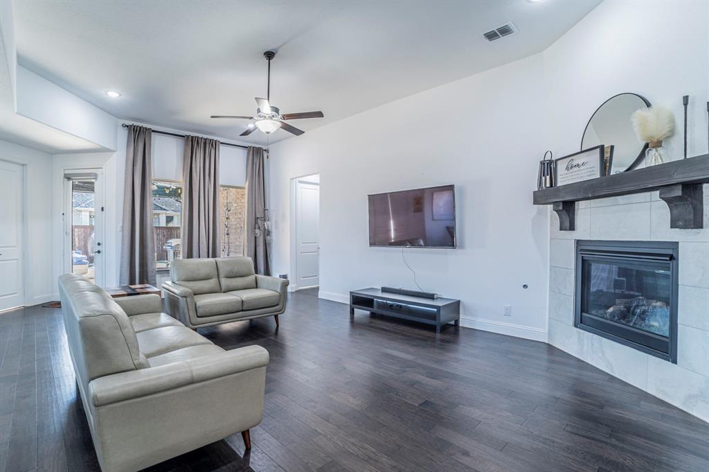 2519 Bedford Road Northlake, TX 76226 - Photo 4 of 33 a living room with furniture and a fireplace