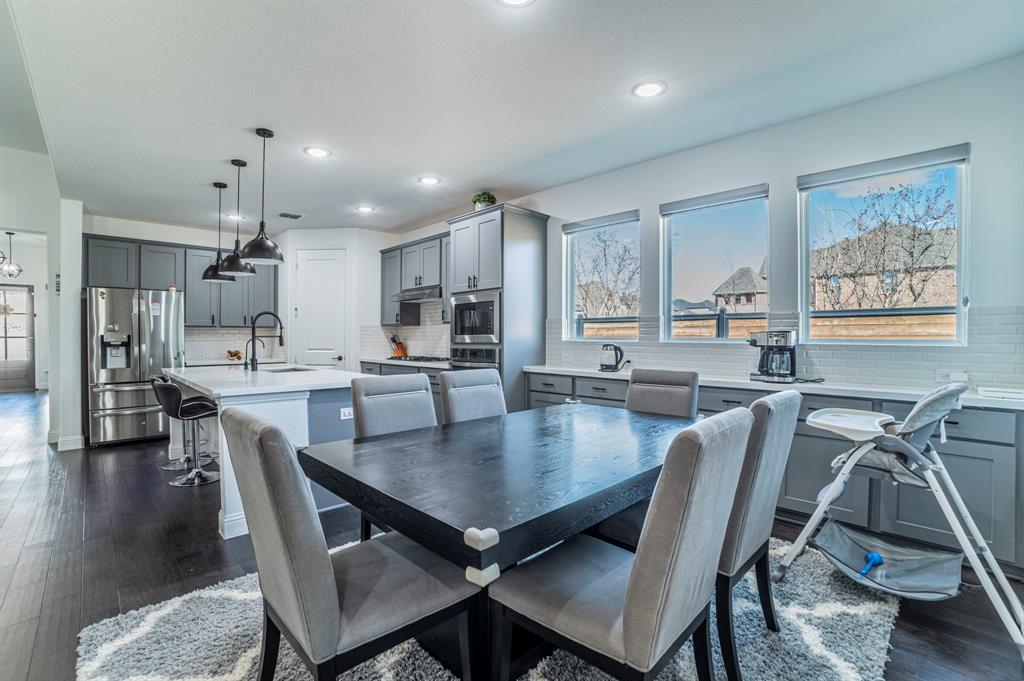 2519 Bedford Road Northlake, TX 76226 - Photo 10 of 33 a view of a dining room with furniture and wooden floor