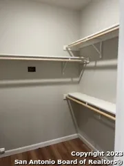 a bathroom with a shower and a sink