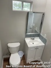 a bathroom with a sink a mirror and shower