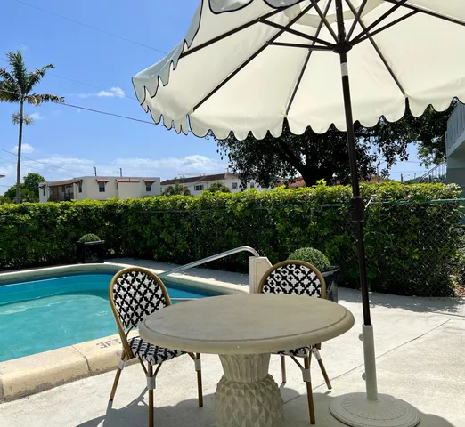 a table and chairs with the table in the back yard