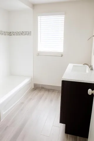a bathroom with a sink and a bathtub