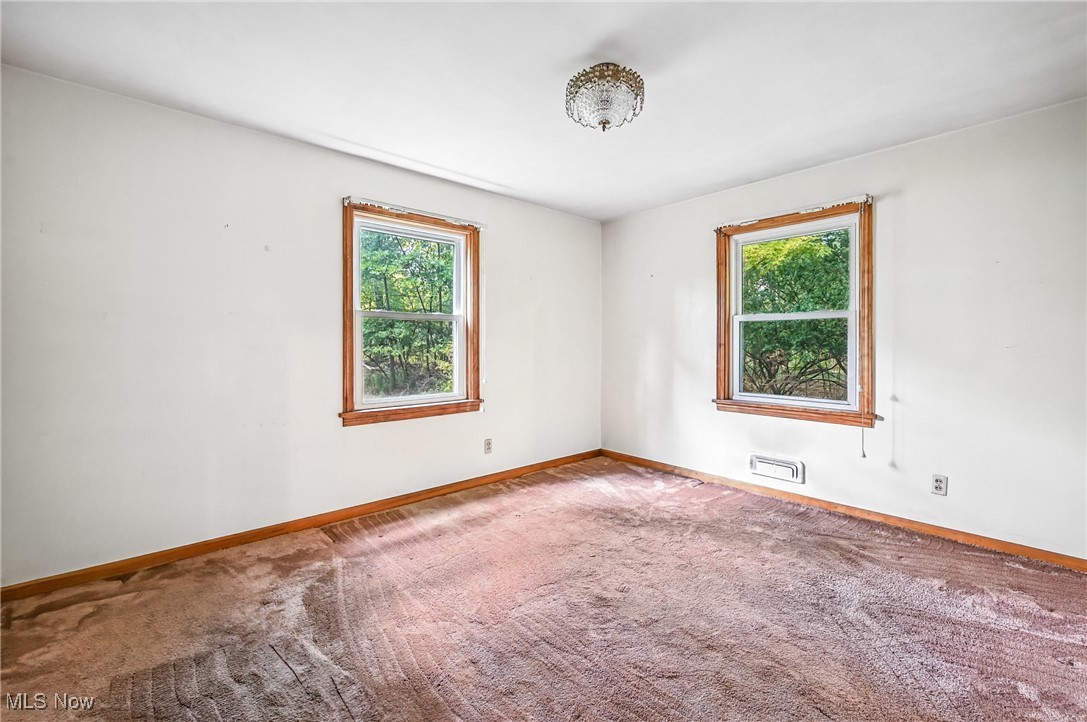 4957 South Raccoon Road Canfield, OH 44406 - Photo 33 of 43 Spare room with baseboards and carpet