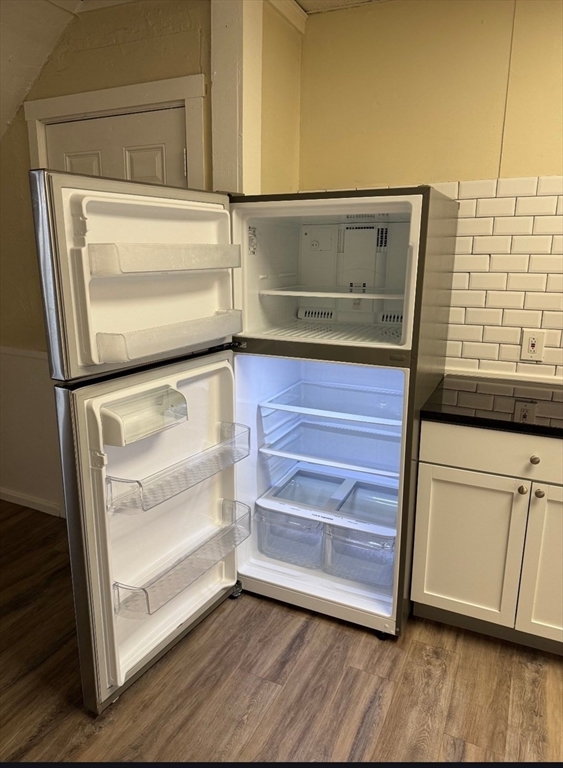 341 Lakeview Avenue, Unit 9 Lowell, MA 01850 - Photo 6 of 8 a view of walk in closet with empty racks