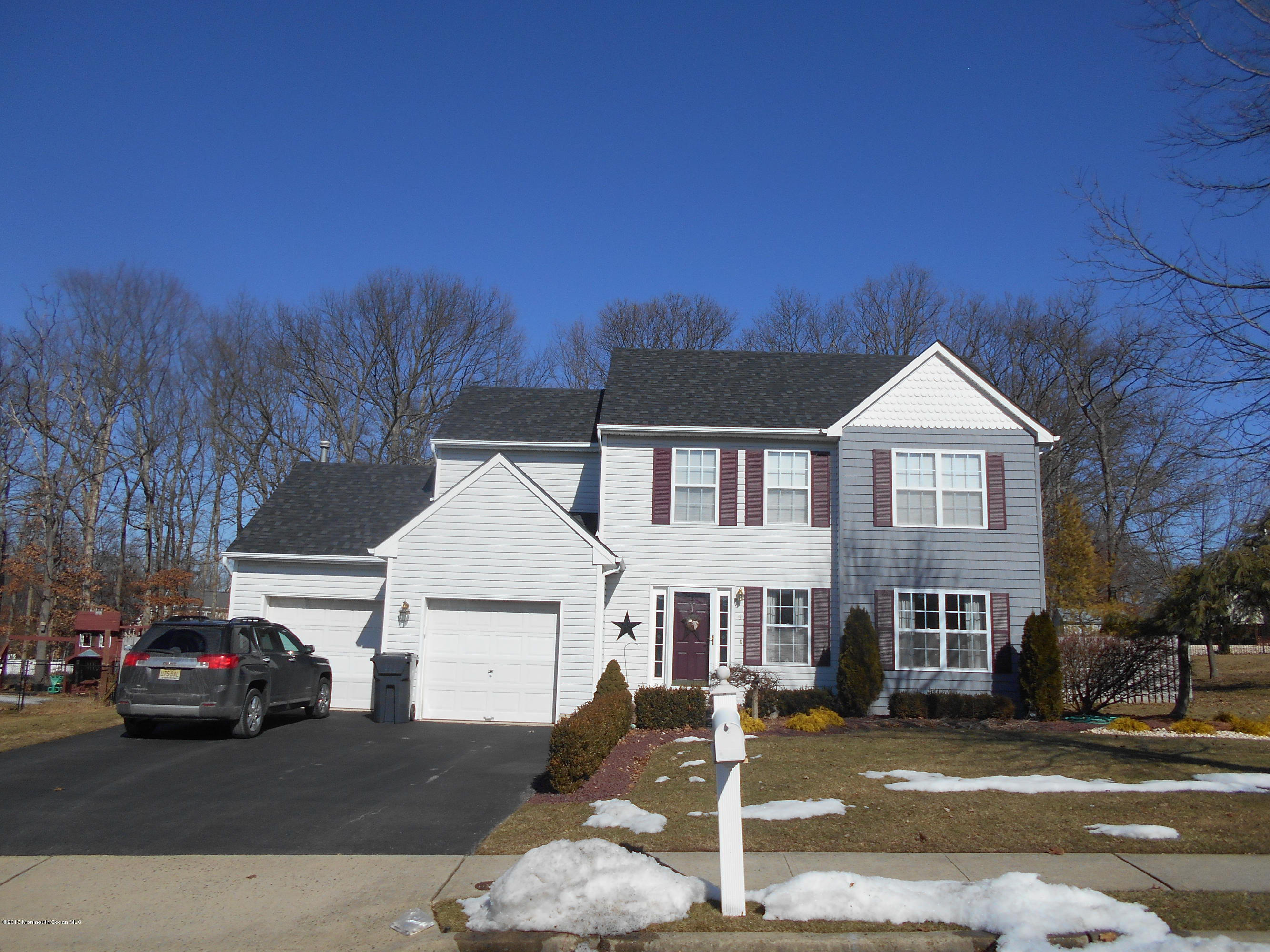4 Capitol Reef Road Howell, NJ 07731 - Photo 1 of 15 a view of a car in front of house