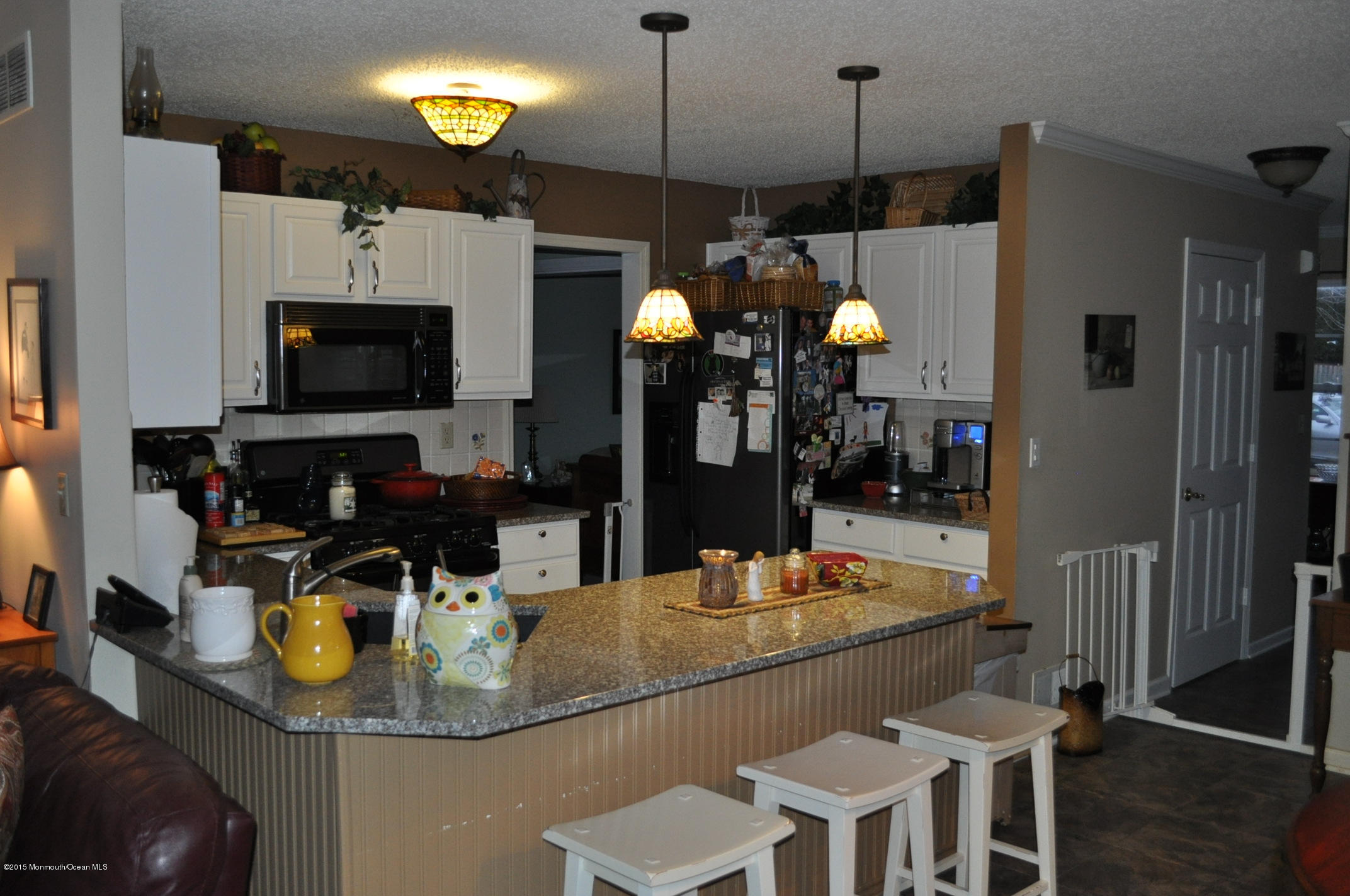 4 Capitol Reef Road Howell, NJ 07731 - Photo 4 of 15 a dining table chairs and a stove