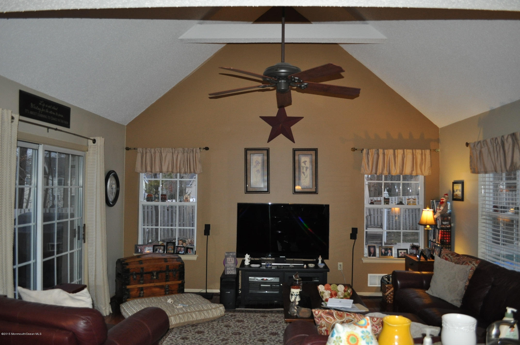 4 Capitol Reef Road Howell, NJ 07731 - Photo 5 of 15 a living room with furniture a flat screen tv and a lamp