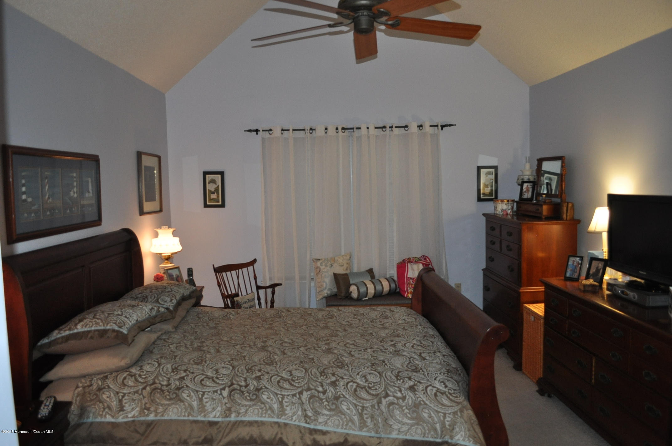 4 Capitol Reef Road Howell, NJ 07731 - Photo 6 of 15 a living room with furniture a window and a flat screen tv