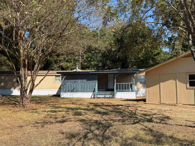 a house with trees in front of it