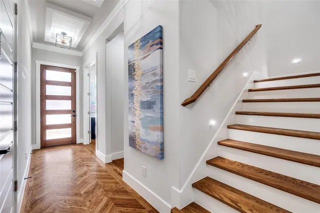 a view of entryway with stairs and wooden floor