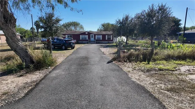 a view of house with outdoor space and sitting area