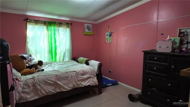 a bed room with a bed and a dresser