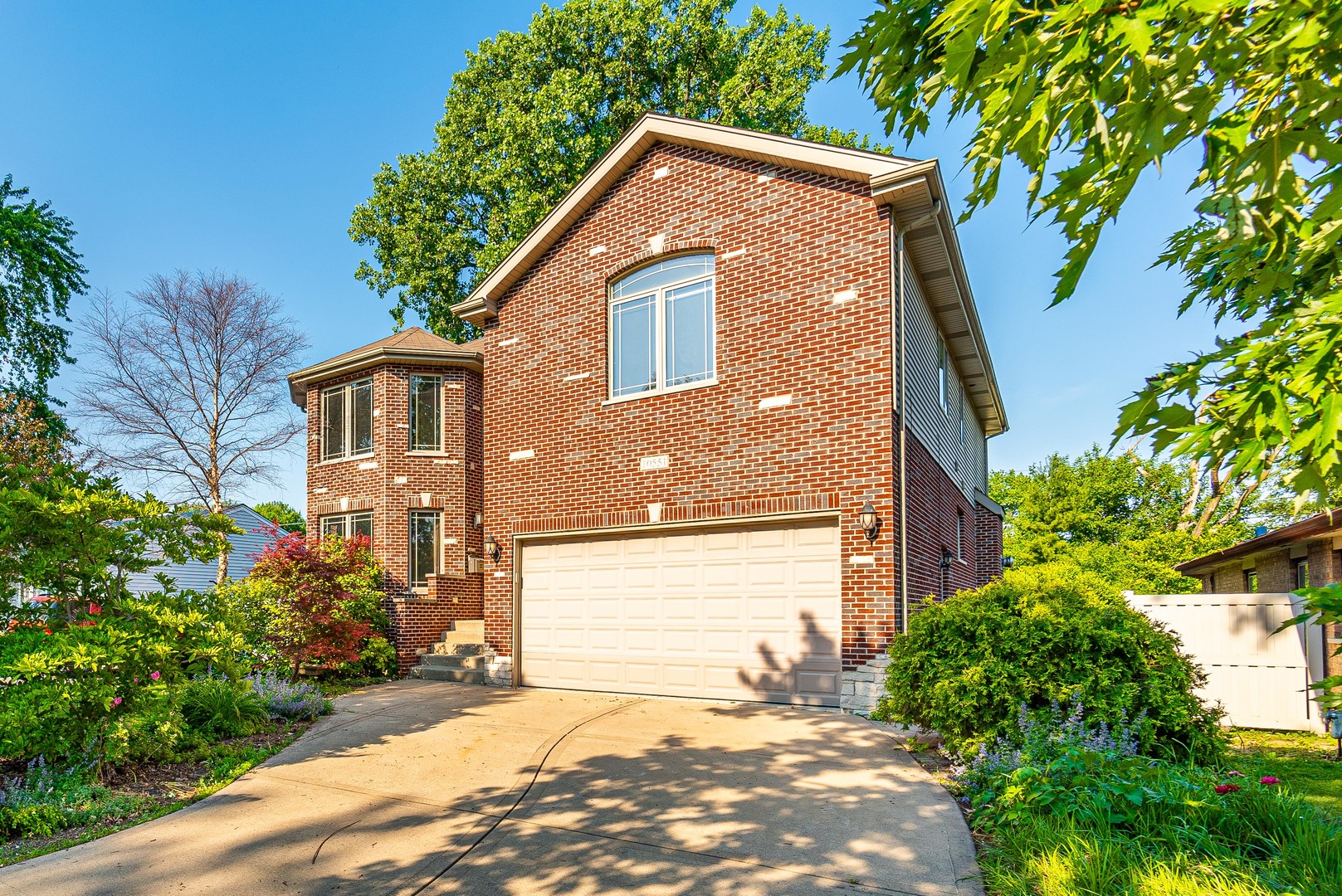 10551 Princess Avenue Chicago Ridge, IL 60415 - Photo 1 of 26 a front view of a house with a garden