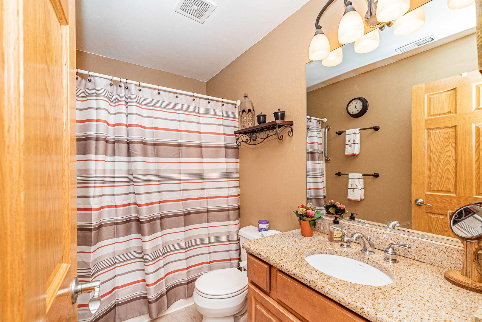 10551 Princess Avenue Chicago Ridge, IL 60415 - Photo 14 of 26 a bathroom with a granite countertop bathtub sink vanity mirror and shower