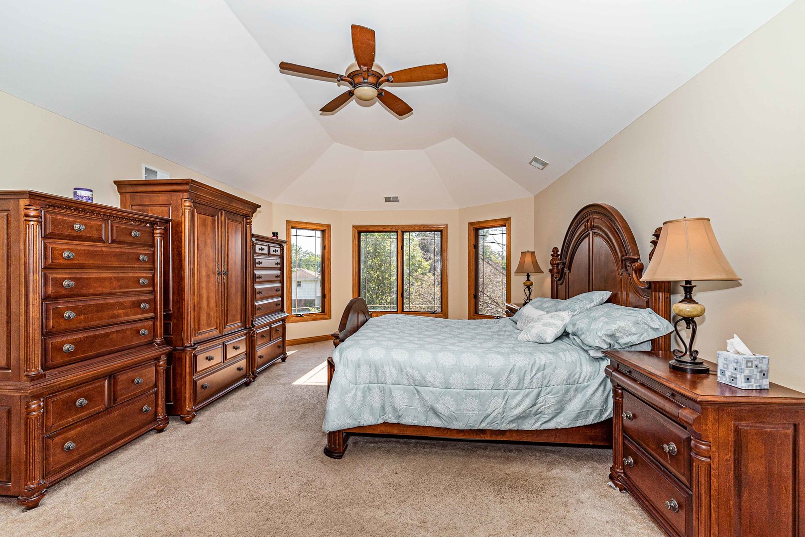 10551 Princess Avenue Chicago Ridge, IL 60415 - Photo 20 of 26 a bedroom with a bed a dresser and a chandelier