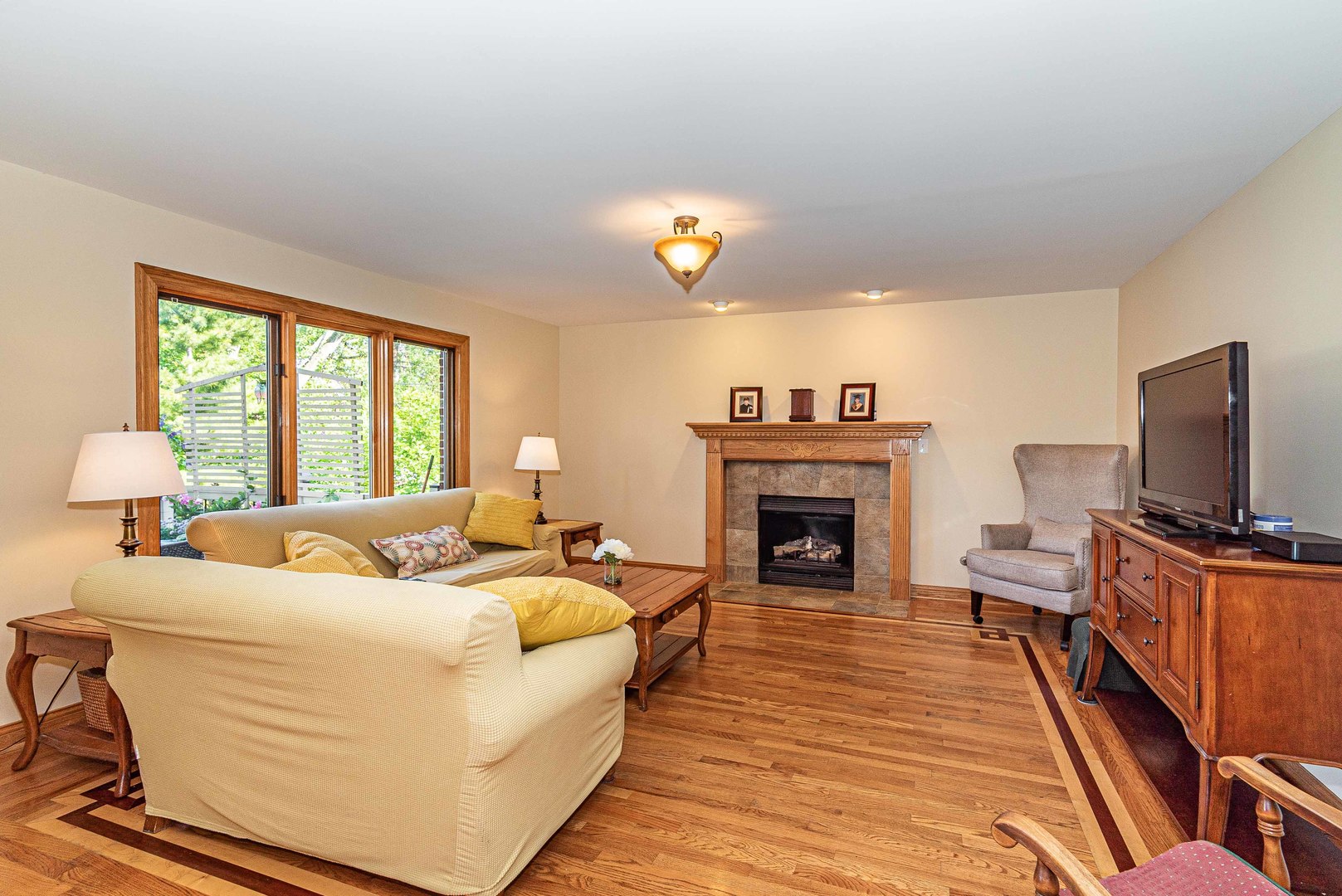 10551 Princess Avenue Chicago Ridge, IL 60415 - Photo 7 of 26 a living room with furniture fireplace and flat screen tv