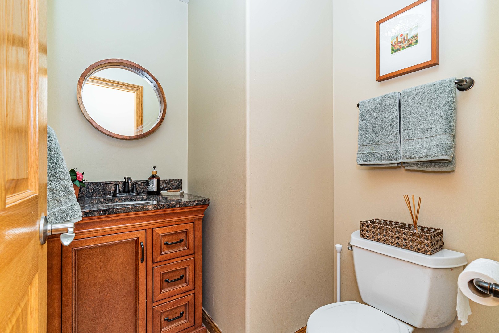 10551 Princess Avenue Chicago Ridge, IL 60415 - Photo 9 of 26 a bathroom with a toilet a sink and a mirror
