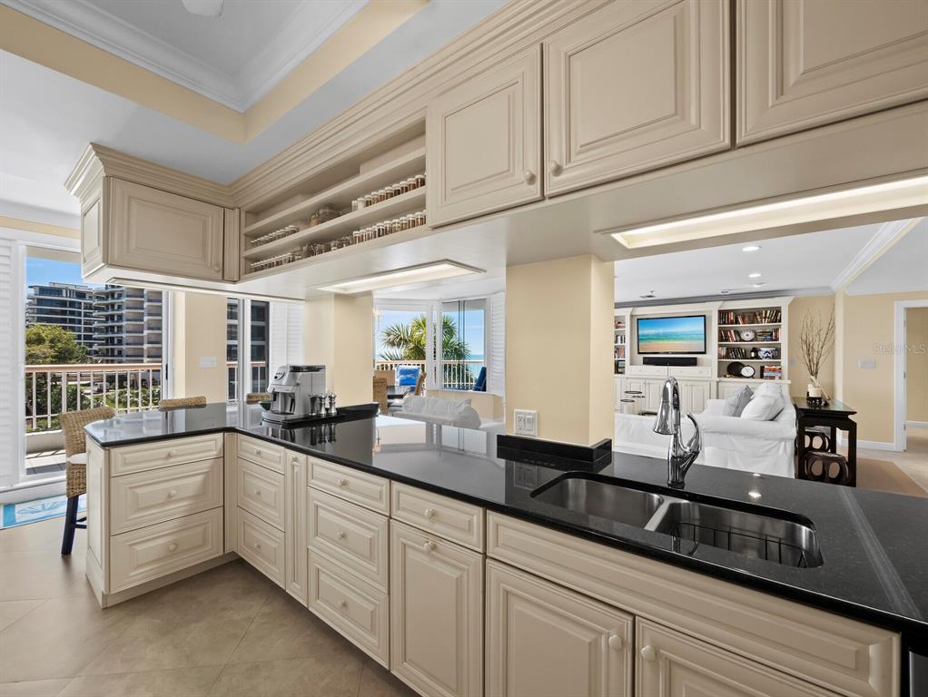 455 Longboat Club Road, Unit 402 Longboat Key, FL 34228 - Photo 13 of 50 a kitchen with sink and cabinets