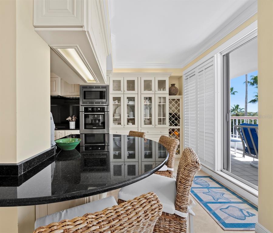 455 Longboat Club Road, Unit 402 Longboat Key, FL 34228 - Photo 15 of 50 a living room with furniture