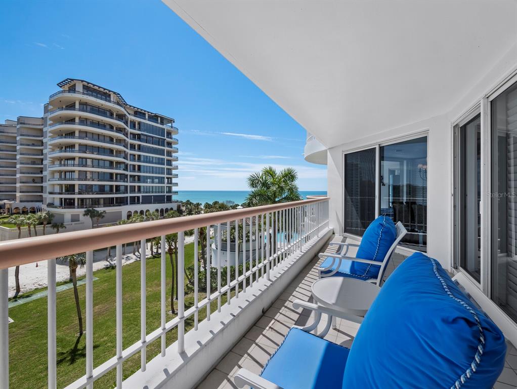 455 Longboat Club Road, Unit 402 Longboat Key, FL 34228 - Photo 23 of 50 a view of balcony with a floor to ceiling window and wooden floor