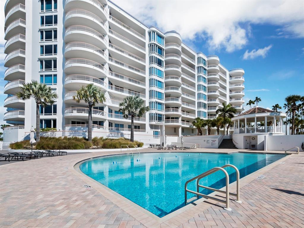 455 Longboat Club Road, Unit 402 Longboat Key, FL 34228 - Photo 34 of 50 a view of a swimming pool with outdoor seating