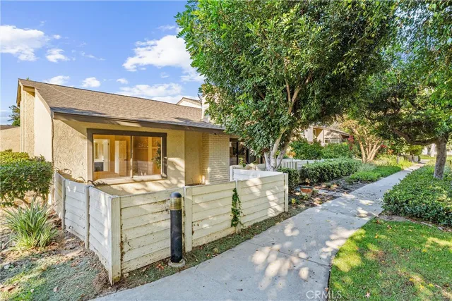 a view of a house with swimming pool and sitting area