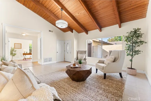 a living room with furniture and a rug