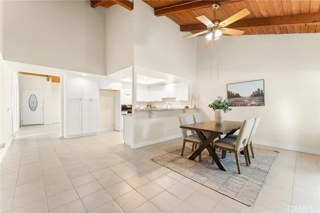 a view of a dining room and livingroom with furniture