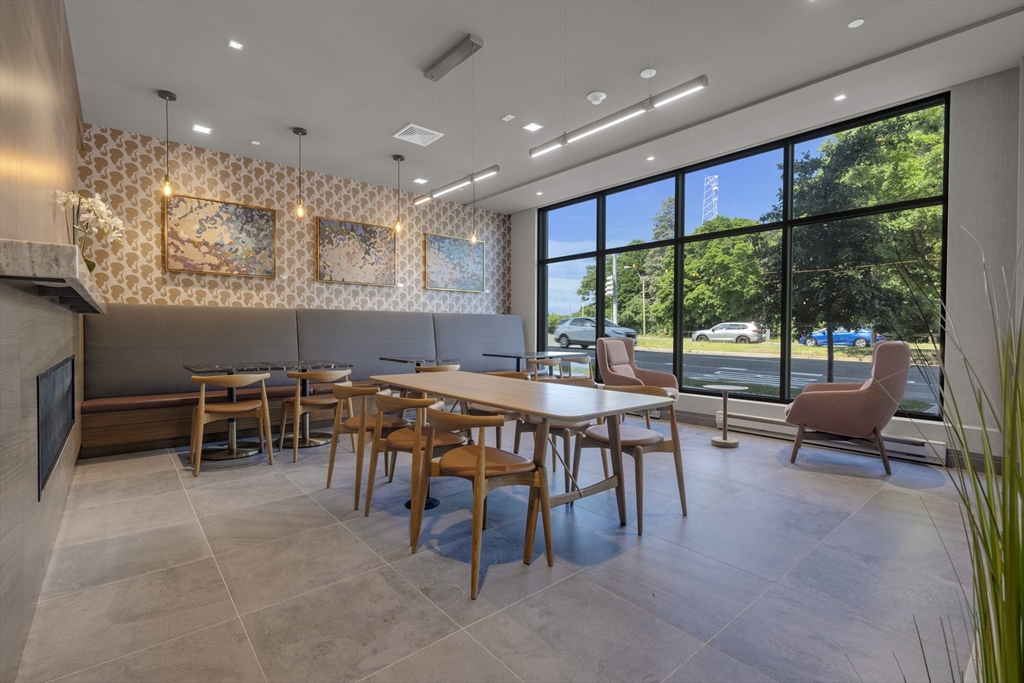 70 Leo M Birmingham Parkway, Unit U307 Boston, MA 02135 - Photo 21 of 35 a view of a big dining room with furniture window and outside view