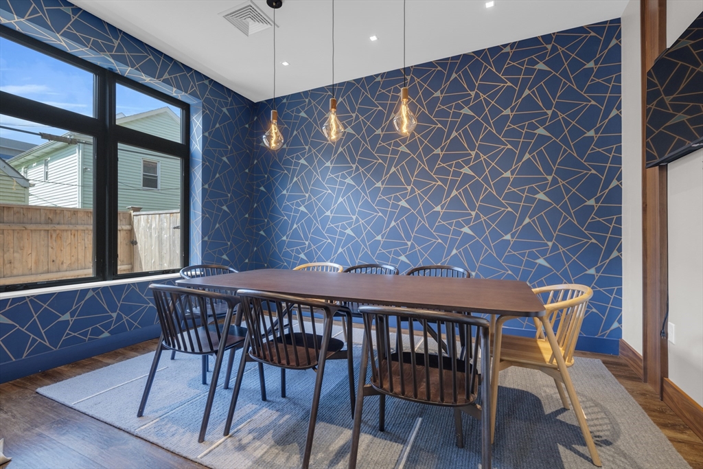 70 Leo M Birmingham Parkway, Unit U307 Boston, MA 02135 - Photo 29 of 35 a table and chairs in a room