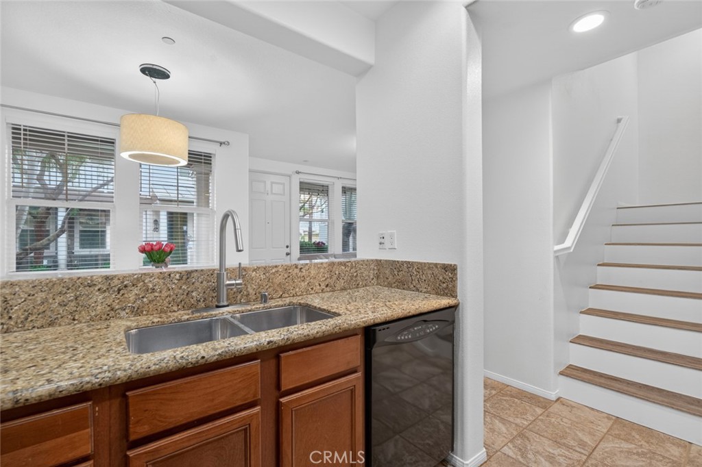 14 Valmont Way Ladera Ranch, CA 92694 - Photo 13 of 39 a bathroom with a granite countertop sink and a mirror