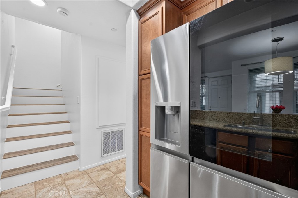 14 Valmont Way Ladera Ranch, CA 92694 - Photo 14 of 39 a kitchen with stainless steel appliances granite countertop a refrigerator and a sink