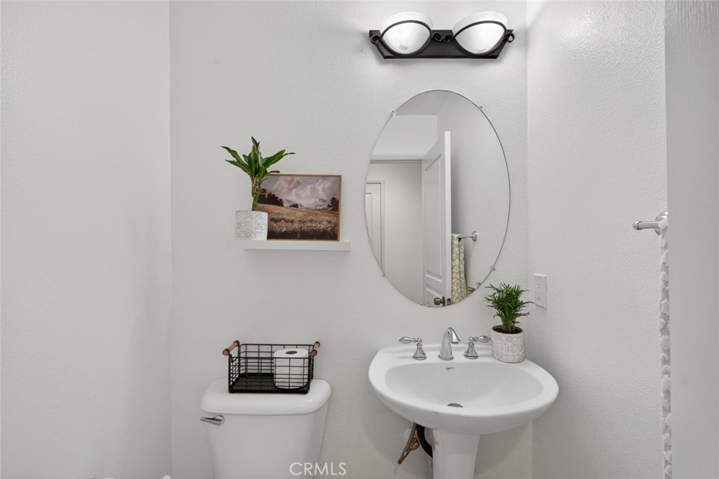 14 Valmont Way Ladera Ranch, CA 92694 - Photo 15 of 39 a bathroom with a sink and a mirror
