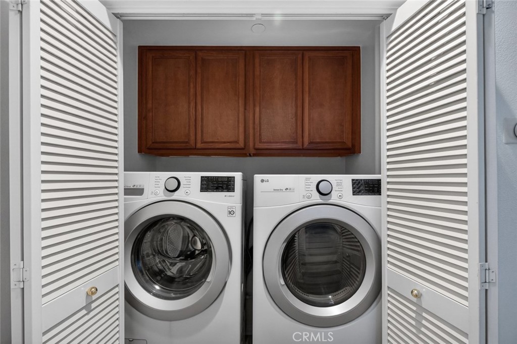 14 Valmont Way Ladera Ranch, CA 92694 - Photo 16 of 39 a view of a hallway with washer and dryer
