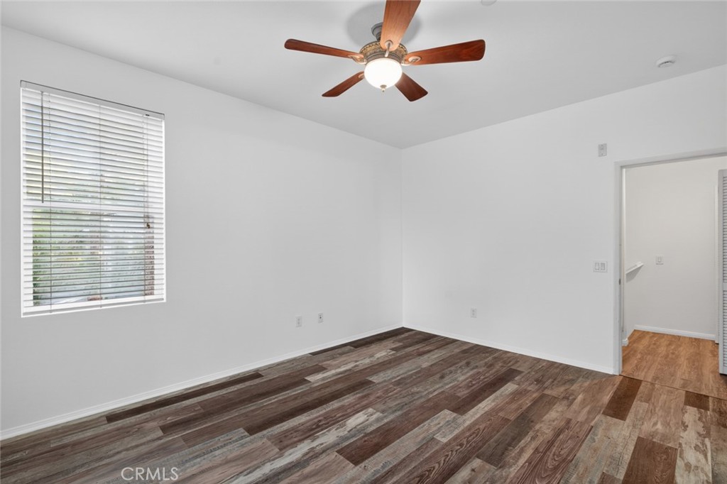 14 Valmont Way Ladera Ranch, CA 92694 - Photo 20 of 39 a room with a bed and a ceiling fan