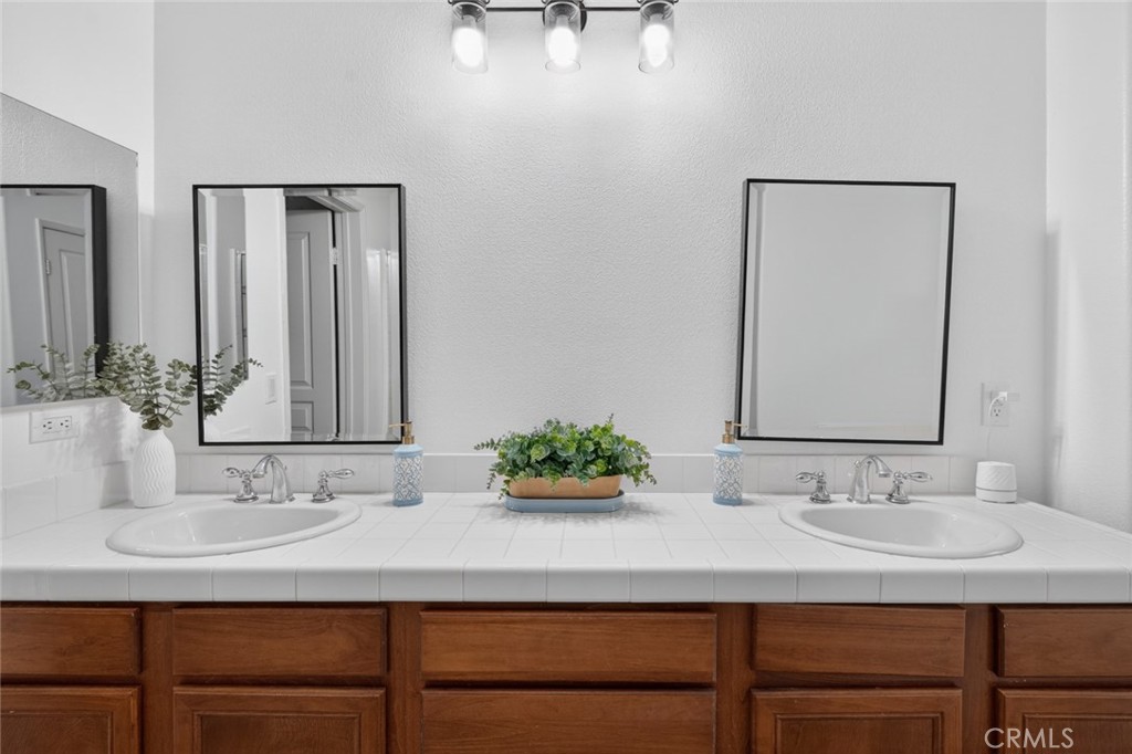 14 Valmont Way Ladera Ranch, CA 92694 - Photo 21 of 39 a bathroom with a sink and a mirror