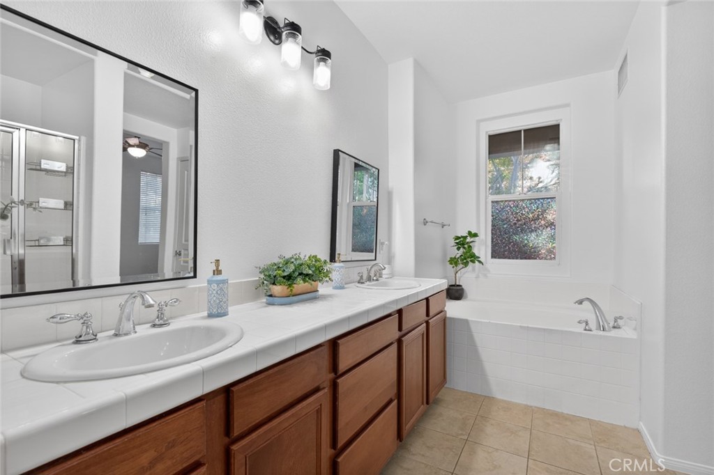 14 Valmont Way Ladera Ranch, CA 92694 - Photo 22 of 39 a bathroom with a sink and a bathtub